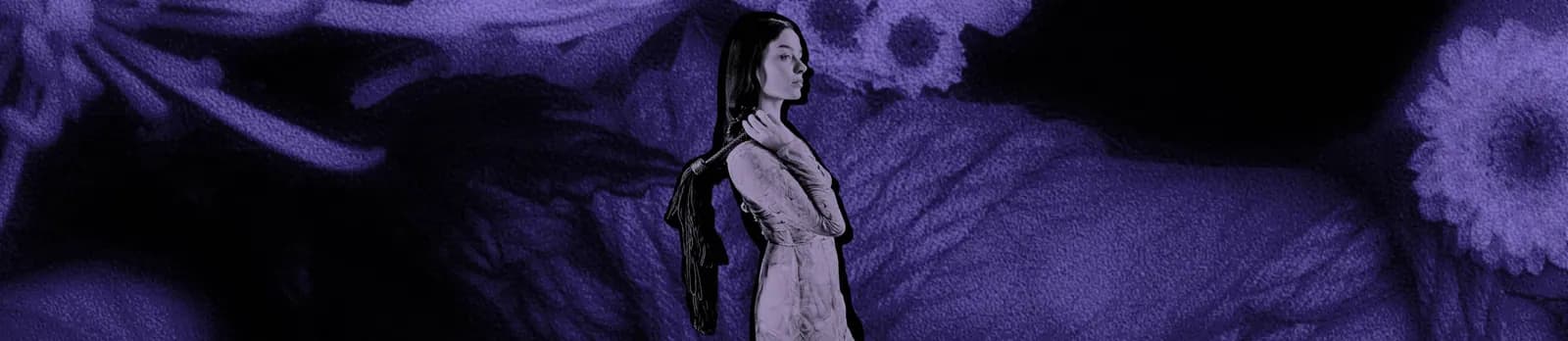 A person in a pale dress holding a flogger over one shoulder against an abstract purple background.