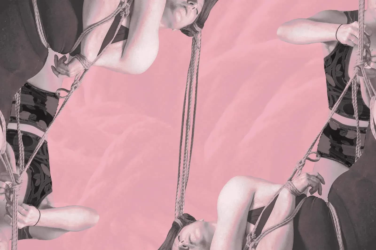 A rigger and bottom are tying a shibari suspension with hair rope on a pink background.