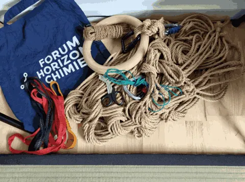 Illustration of a person's legs bound with red rope viewed from above.