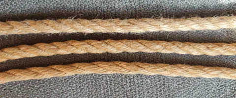 Close-up of conditioned and unconditioned jute ropes side by side showing texture difference.