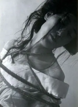 Vintage photograph of a person bound in rope bondage.